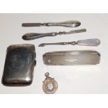 A silver cigarette case and other items