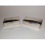 Two plain silver cigarette boxes