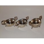 A pair of silver sauce boats and one other (3)