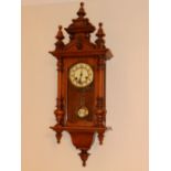 A 19thC German walnut cased striking wall clock, 36” high overall