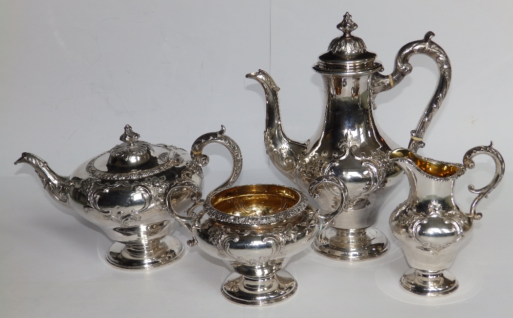 An early Victorian four piece silver tea & coffee service, of circular plan the sides of double ogee