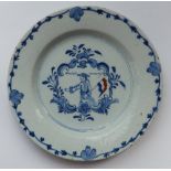 An 18thC Dutch delft blue & white dish,, painted to centre with a male figure in hat, holding the