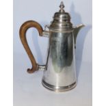 A tapering silver hot water jug retailed by Tessier – London marks for 1916