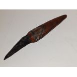 A tribal knife with resin handle and obsidian blade