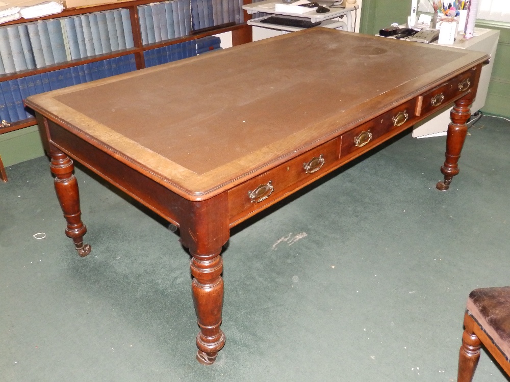 A Victorian library table on turned legs with leather inset top – top loose.