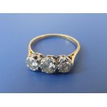 A three stone illusion set diamond ring – total diamond weight approximately .80 carat.