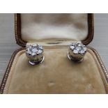 A pair of diamond cluster earrinss of total diamond weight approximately 1.5 carats, in .750 white