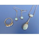 An opal pendant necklace, a pair of opal drop earrings and an opal five stone ring. (4)