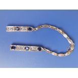 A blue & white stone set bracelet – broken into two sections, together with two rings. (3)