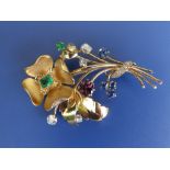 An emerald, ruby, sapphire & diamond set yellow metal floral spray brooch, 2.25”