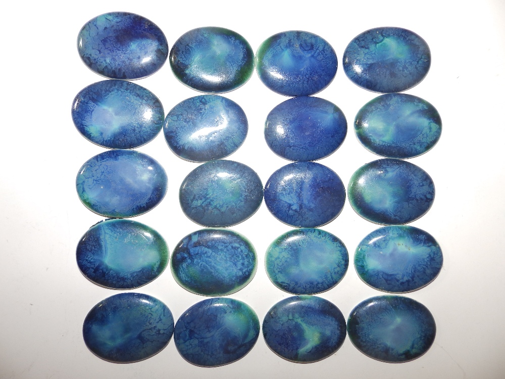 20 blue oval Ruskin cabochon plaques.