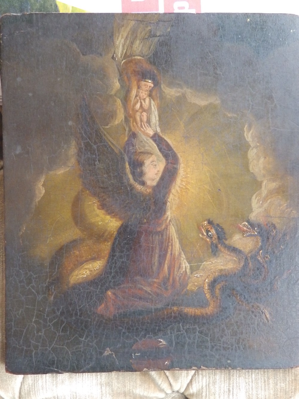 An antique oil on panel – An Angel lifting a child to heaven, watched by a hydra.