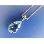 An aquamarine & diamond pendant necklace.