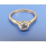 A diamond solitaire ring, the claw set brilliant weighing approximately 0.40 carat on yellow '
