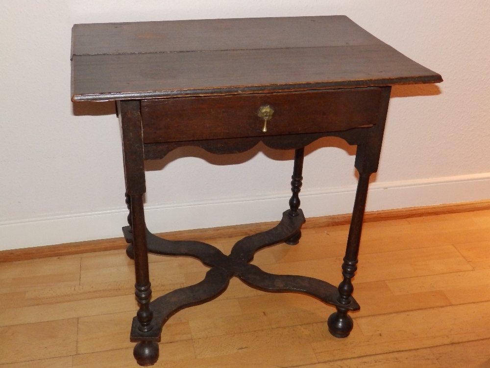 A late 17th/early 18thC oak side table, with frieze drawer over slender turned legs united by shaped