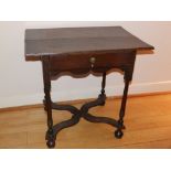 A late 17th/early 18thC oak side table, with frieze drawer over slender turned legs united by shaped