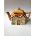 A cottage ware teapot – 'Festival of Britain 1951'.