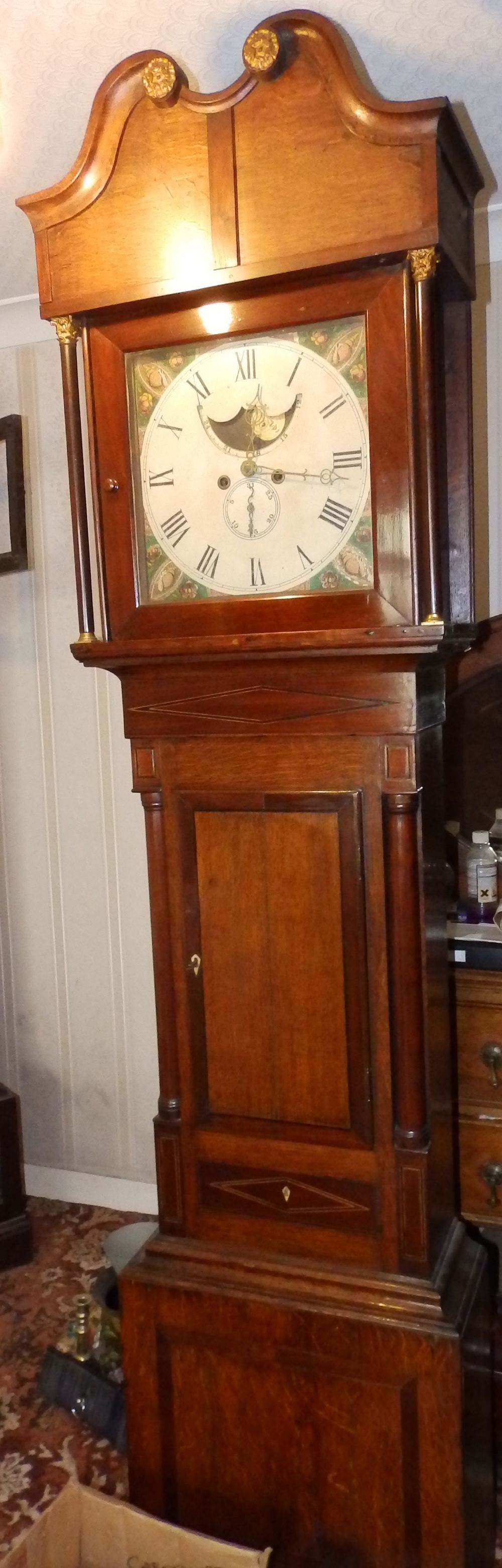 An eight day bell-striking painted dial longcase clock with moonphase in mahogany banded oak