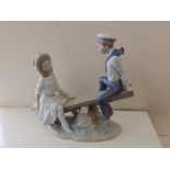 A Lladro figure group – see-saw.