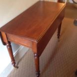 A 19thC mahogany pembroke table, with frieze drawer on round tapering legs, 17” extending to 35”,