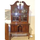 A late 19th/early 20thC mahogany two-stage bookcase in the American 18thC style, the base with