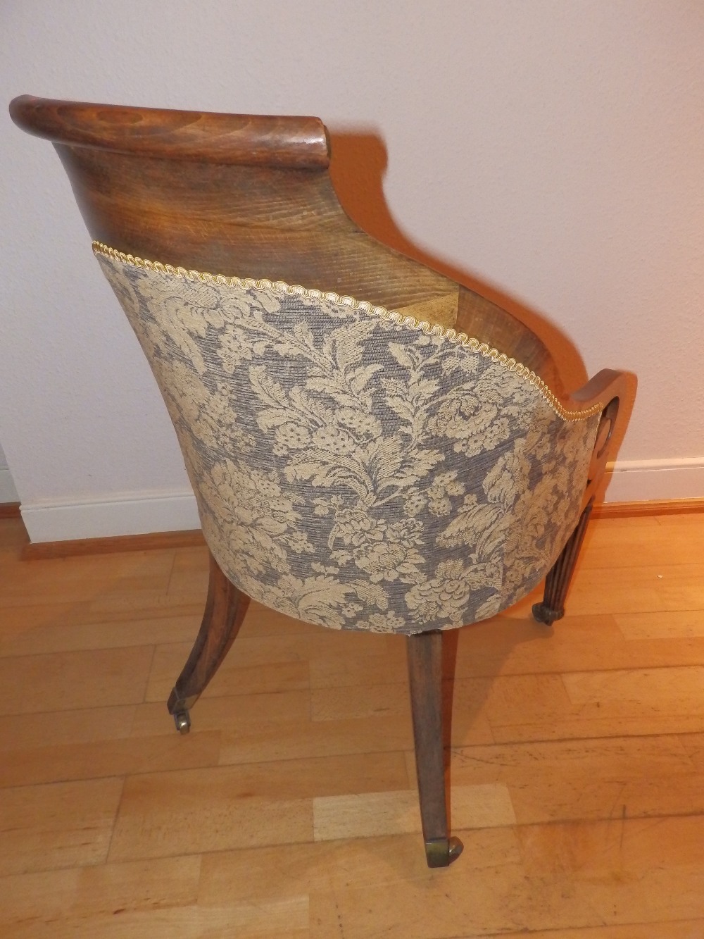 A 19thC upholstered beech bergere library chair, on reeded tapering front legs to castors, Height - Image 2 of 2