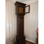 A brass dial bell striking 30 hour carved oak longcase clock, the 10” square dial inscribed '