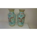 A pair of 19thC Chinese dragon vases with pale turquoise grounds, yellow borders, 8” - a/f