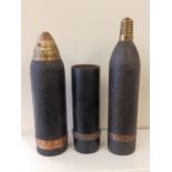 A WWI French 75mm shrapnel shell with beehive fuse, a British 18 pounder shrapnel shell, together