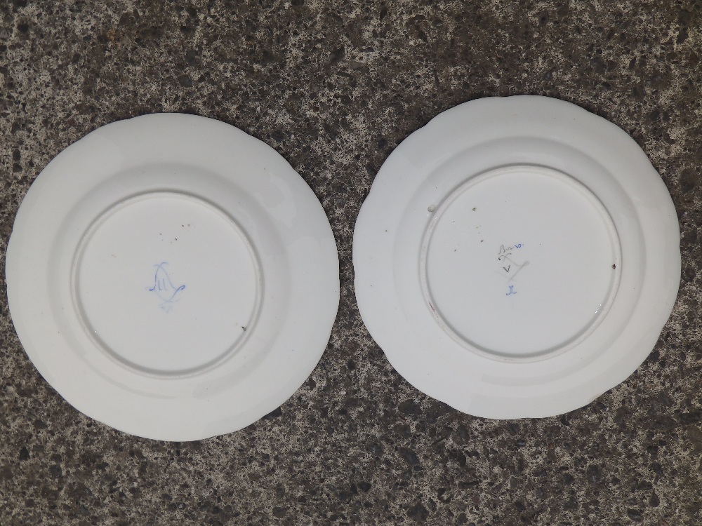 Two similar floral painted porcelain plates – interlaced 'L' marks in blue – one chipped. - Image 2 of 2