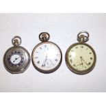 An Omega silver half hunter pocket watch and two other Omega pocket watches. (3)