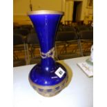 A 19thC French bleu-de-roi glazed vase with ormolu mounts.