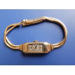A lady's 9ct gold art deco Rolex wrist watch – face & movement a/f on 18ct gold double strand
