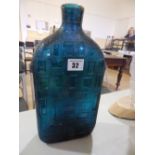 A large moulde blue glass bottle – 'Made In Italy' – neck broken.
