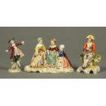 A Continental porcelain figure group, children with dog, and two others. Tallest 13 cm. CONDITION