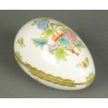 A Herend lidded egg casket, Victoria design, blue printed mark.  Length 16 cm.