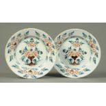 A pair of 18th century Delft plates, polychrome. Diameter 23 cm. CONDITION REPORT: Neither plate has