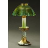 A Louis Comfort Tiffany Favrile candle lamp, circa 1910, part opal glass with green feather pattern,