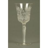 A large 19th century engraved glass, foliate and with air twist stem.  Height 26 cm.