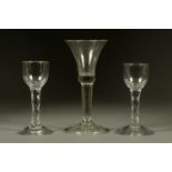 An 18th century folded foot wine glass, and two antique cordial glasses.  Tallest 17 cm.