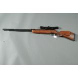 BSA Supersport Mark 2 .22 underlever air rifle, fitted with Bushmaster 4 x 32 telescopic sight.