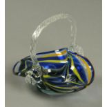 A Murano coloured glass basket, blue and yellow with clear loop handle. Length 17.5 cm.