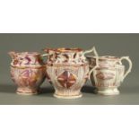 Three 19th century relief moulded pink lustre milk jugs. Tallest 15.5 cm.