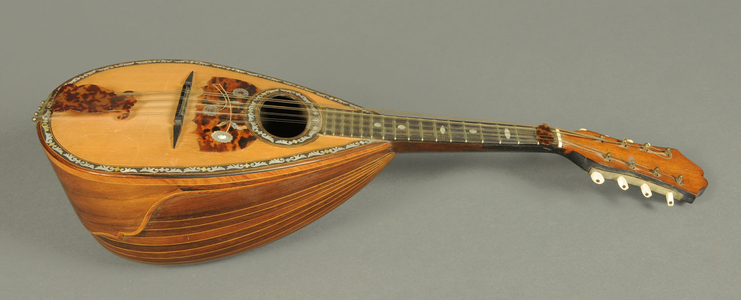 A mandolin by Ferrari & Co., rosewood and mother of pearl inlaid.