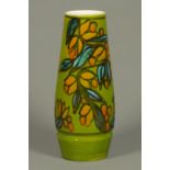 A Poole Pottery vase, with green ground and floral pattern, circa 1960s. Height 14 cm.