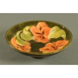 A Moorcroft shallow dish, printed label "By Appointment Potters to The Late Queen Mary",