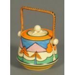 WITHDRAWN - A Clarice Cliff Bizarre lidded biscuit barrel,