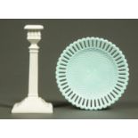 A Sowerby blue glass pierced plate, and a candlestick. Plate diameter 22 cm.