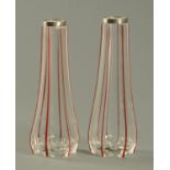 Two silver topped red and clear glass striped vases. Height 20 cm.