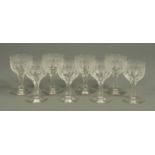 Eight Edwardian engraved dessert wine glasses.